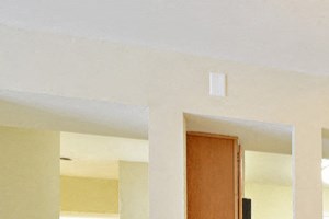 Dining room that opens into kitchen and bedroom. Window to kitchen that can be used for serving.
